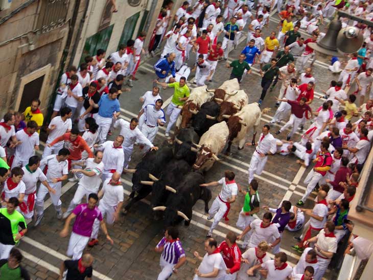 The Bull Running in Pamplona, Spain.